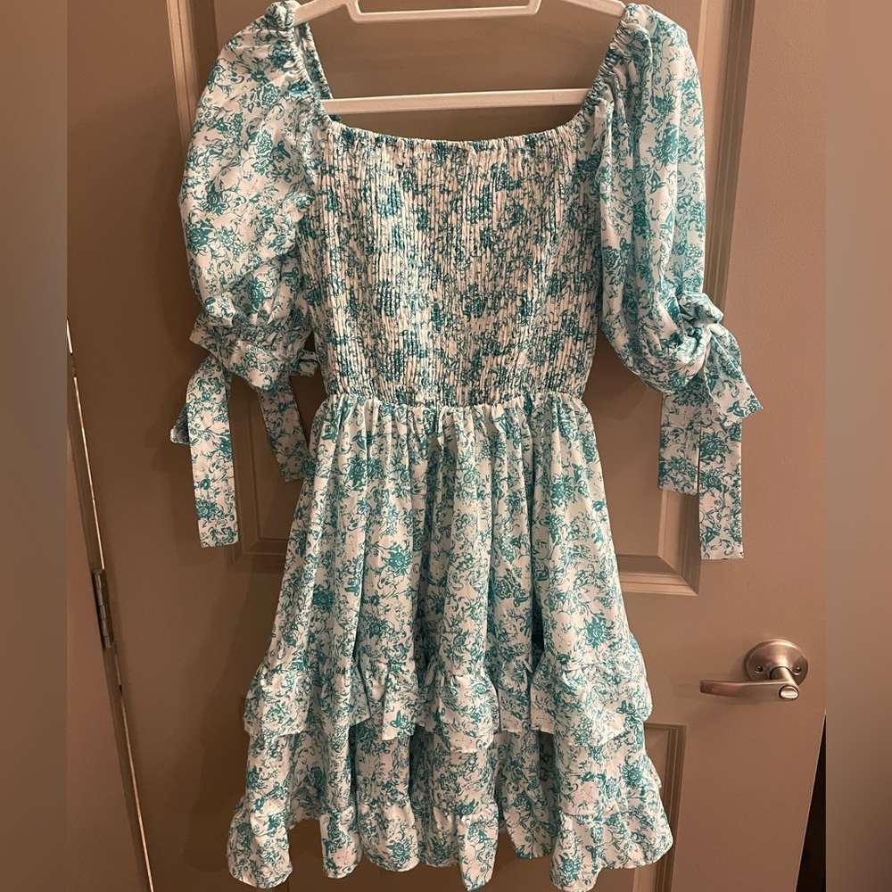 Boutique floral off the shoulder ruffle dress with bow details